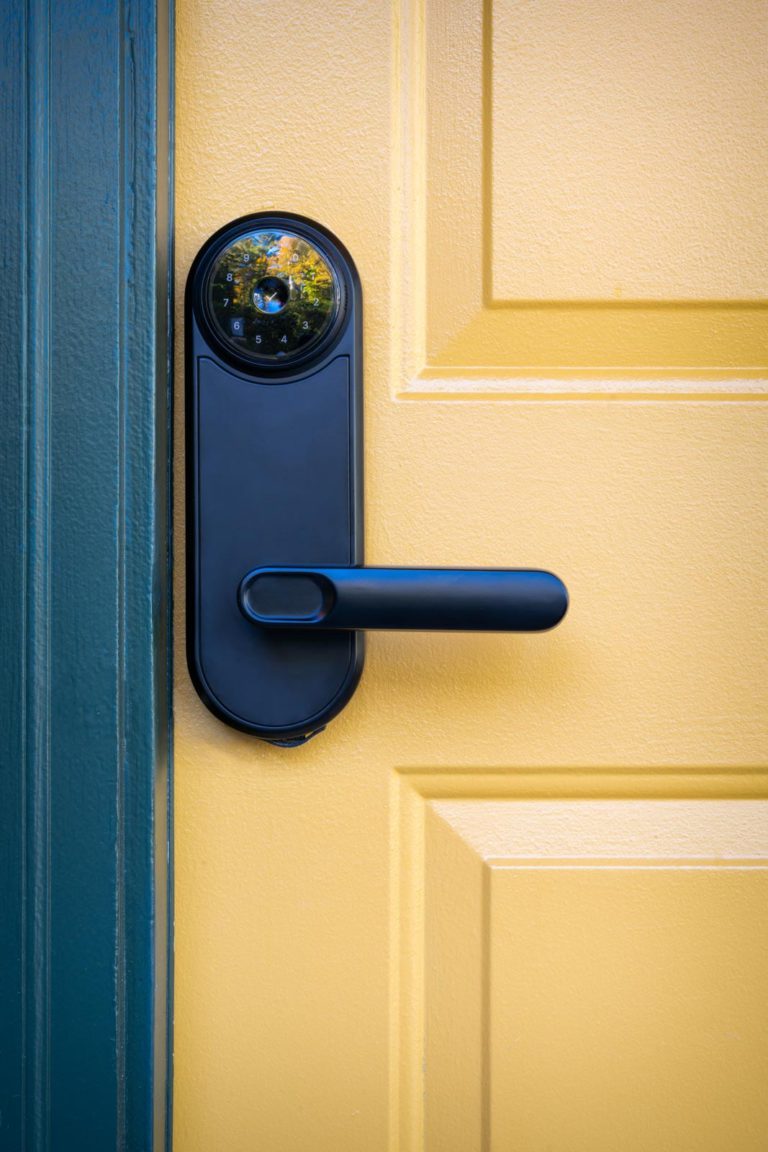 A door handle with a camera on it.
