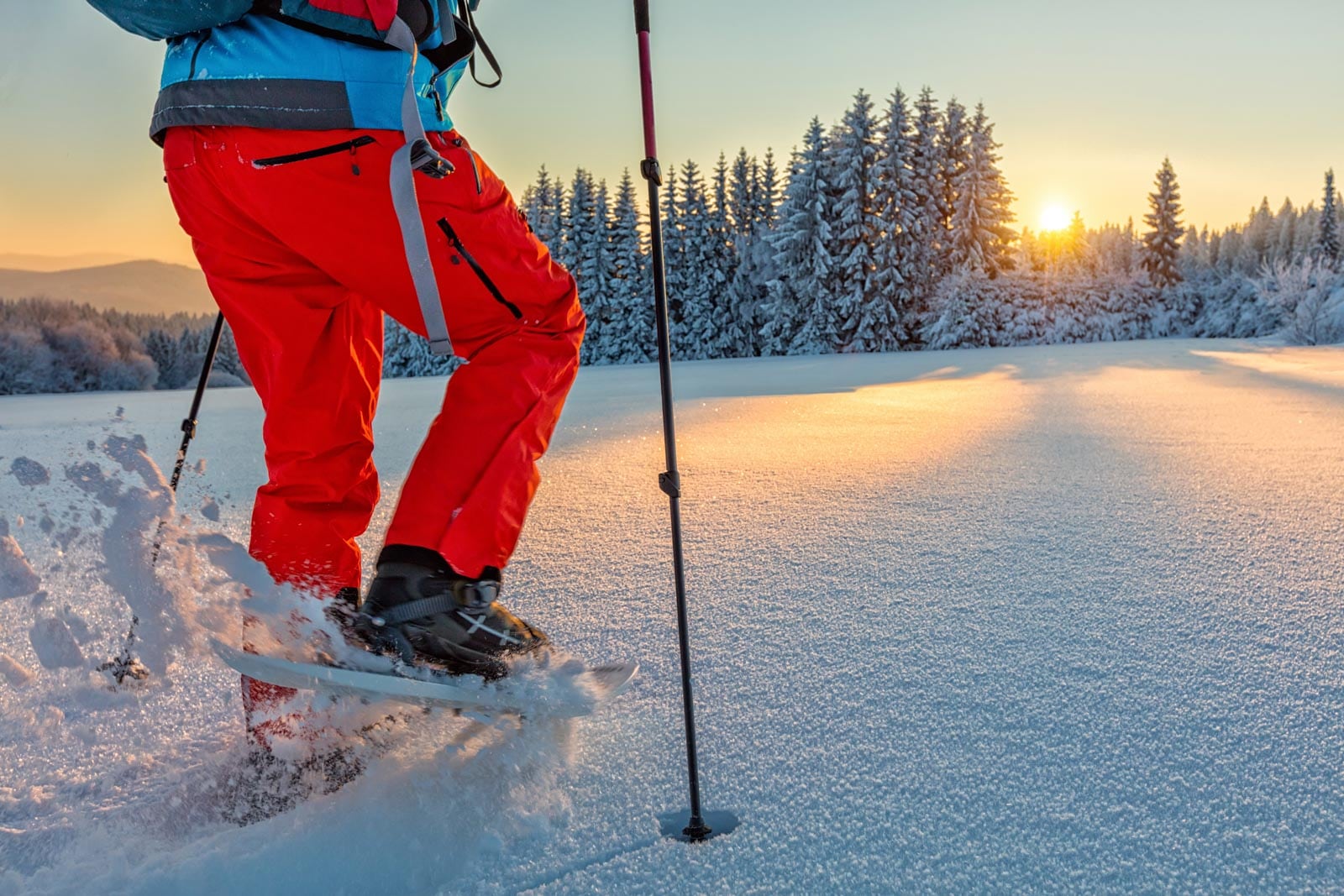 A person is standing on skis in the snow.